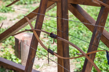 Vintage wooden bow stand outdoor on summer festival