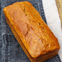 Gluten-free whole grain rye bread on the sackcloth background. Healthy food concept..