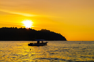 Fototapeta na wymiar Sunset landscape with boats, Pangkor island, Malaysia