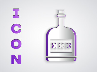 Paper cut Alcohol drink Rum bottle icon isolated on grey background. Paper art style. Vector Illustration