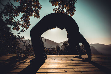 Meditation with yoga exercises in the beautiful mountain valley of Uttarakhand in India, the name...