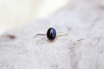 White metal silver ornamental ring with tourmaline mineral stone