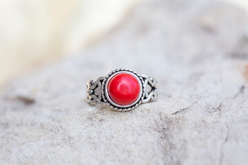 White metal silver ornamental ring with red coral mineral stone