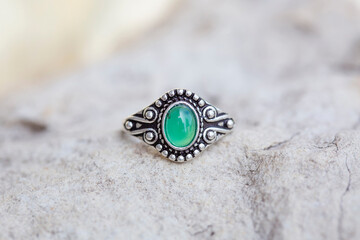 White metal silver ornamental ring with jade mineral stone