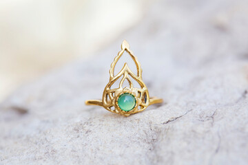 Golden metal silver ornamental ring with red jade mineral stone