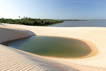 A beautiful dune and lagoon of Tatajuba beach near Jericoacoara, in Ceara state, Brazil