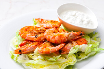 still lfe of grilled shrimps with garlic dip
