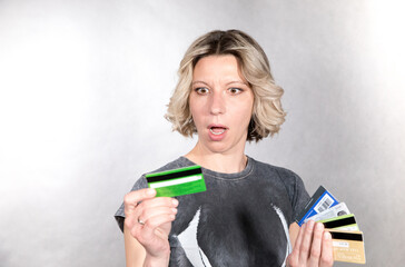 woman holds credit cards in a doubling mood