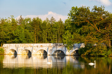 Fototapeta na wymiar Old stone bridge over Vitek pond, Nova Hlina near Trebon, Jindrichuv Hradec district, Southern Bohemian, Czech Republic
