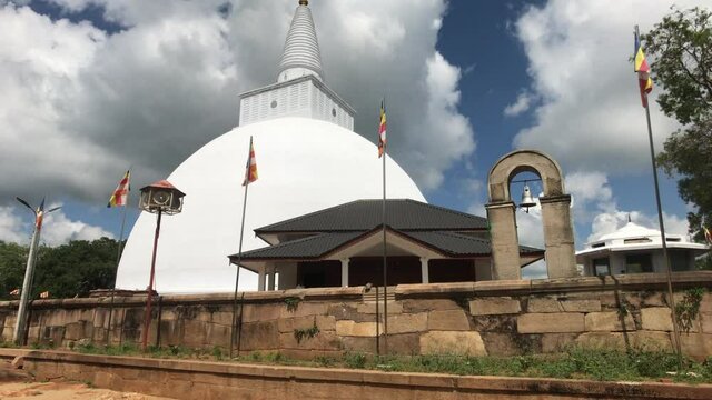 Anuradhapura, Sri Lanka, the view through the flags on a small Dagoba