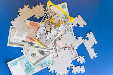 Fototapeta na wymiar Missing jigsaw puzzle pieces on money dollar ob blue background, Business solution concept ,key for success.Conceptual of never ending conflicts between US and Russia on trade.economic crisis