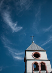 Tower of Sanctuary of Queen of Peace  on the blue sky in Oziornoie, Kazakhstan 