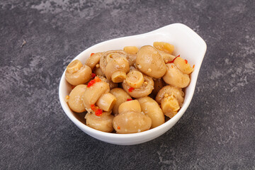 Pickled champignons in the bowl