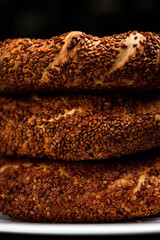 A stack of turkish simit with sesame seeds, macro
