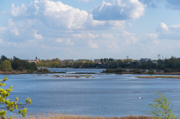 Fototapeta premium View to Daugava river on sunny spring day with the Kekava town on the opposite bank