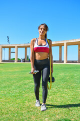Athlete woman moving through the park with her equipment to train outdoors