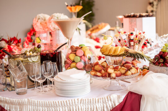 Candy bar with sweet macaroon cakes at a wedding buffet