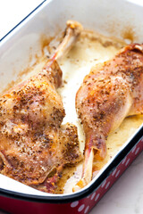baked goose legs with cumin in frying pan
