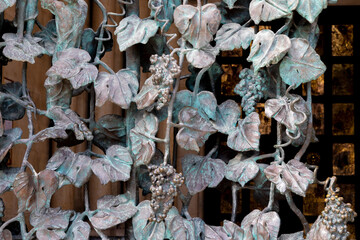wrought-iron grille showing the vines, Pecs, HUngary