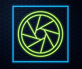 Glowing neon line Camera shutter icon isolated on brick wall background. Vector Illustration