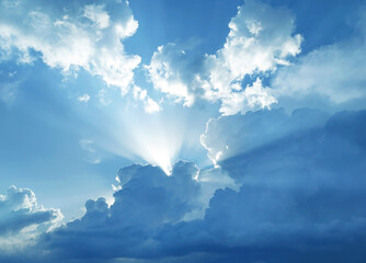 Naklejka na ściany i meble Beautiful cumulus clouds in blue sky illuminated by sunlight