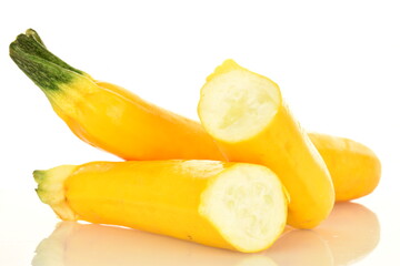 Fresh ripe, bright yellow zucchini, close-up, on a white background.