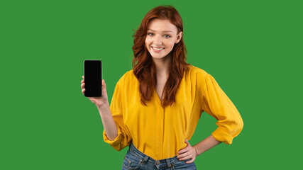 Millennial Girl Showing Cellphone Empty Screen On Green Background, Panorama