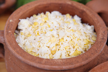 Rice garnish in a pot with yellow peas