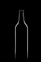 Low-key Studio Shot of a White silhouette of a bottle light glasses isolated on a black Background. Smooth lines and shapes.