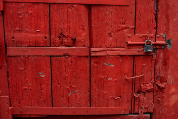 small wooden barn door with a lock