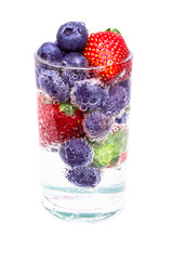 Sparkling water with strawberries and blueberries on white background with clipping path