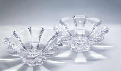 Decorative object in transparent glass, in the shape of a flower, which can be used as a candlestick, among others