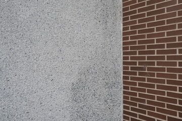 Intersection of brick wall with concrete wall