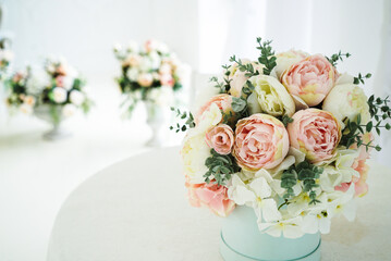 wedding bouquet stand near the window on the table 1