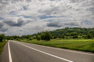 Asphalt road in countryside on sunny summer day in Vrancea region, Barsesti, Romania