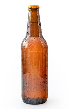 Cold refreshment and alcoholic beverages concept with picture of wet generic brown bottle of beer without branding covered in water droplets isolated on white background with clipping path cutout