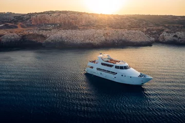 Papier Peint photo autocollant Chypre Cruise yacht at Blue lagoon near Cape Greco Peninsula. Cyprus