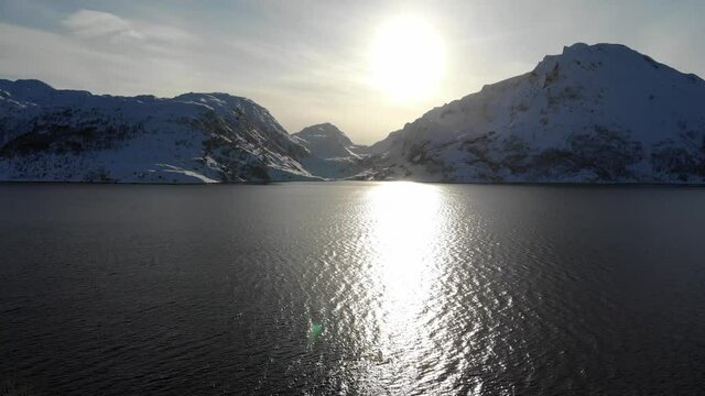 Fjord against the sun, Varangerhalvoya, Soroya, Norway