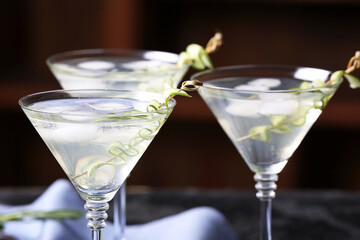 Glasses of tasty cucumber martini  in bar
