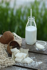 Bottle of milk and coconut marmalade. They pour it on top.
