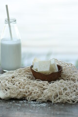 Bottle of milk and coconut marmalade. They pour it on top.
