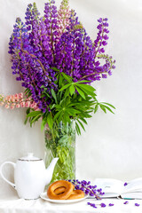 Delicate lupine flowers in a vase. Tender and romantic and a beautiful bouquet of flowers.