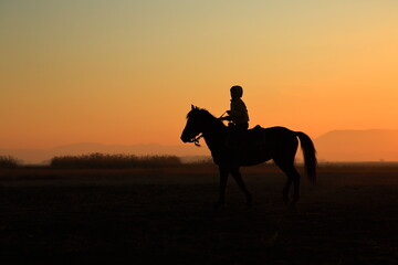 Silhouette view of a horseman at sunset. Cappadocia, Turkey