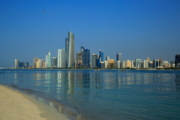 Fototapeta na wymiar Panoramic view of Dubai city from the coast of the heritage village, towers.