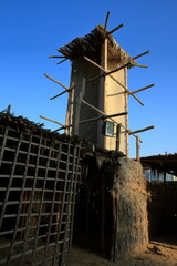 View of the old reed houses inhabited by pearl divers and fishermen in the heritage village of Dubai.