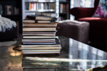 A stack of old notebooks creating a sense of history and secrets