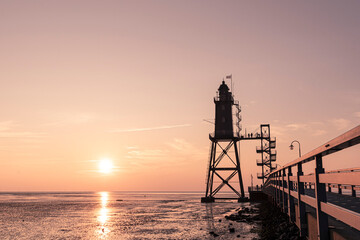 Fototapeta na wymiar sunset over the Lighthouse Obereversand - Wurster Nordseeküste