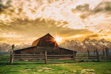 Mormon Row barn in Jackson Hole, Wyoming at sunset © Allen.G