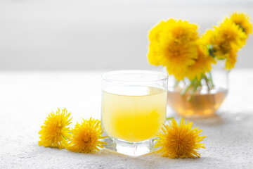 Dandelion tea. Yellow summer flowers dandelions. Tea party Homemade drink. Certified flower tea. An article about teas. Hot drinks article