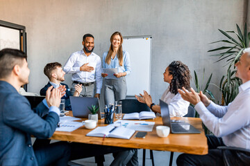 Coworkers Applauding Cheering Colleagues After Successful Speech In Office
